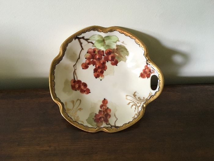 Candy dish with open handle.  Currants with green leaves. Signed MP (Minnie Verna Pickard).  Haviland blank.  Telephone auction begins 5/26/17 at 12 pm. Bidding ends at 2 pm.  Pam Newby. IL Auction License Number 441.002298