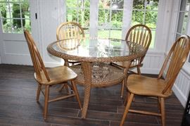 Glass wicker table and 4 of 6 chairs
