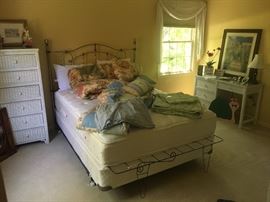 Queen brass bed, wicker furniture, bedding