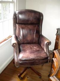 Executive desk, executive leather nail head trim office chair, and executive lateral file cabinet