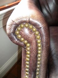 Executive desk, executive leather nail head trim office chair, and executive lateral file cabinet