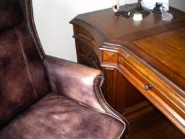 Executive desk, executive leather nail head trim office chair, and executive lateral file cabinet
