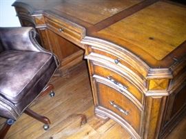 Executive desk, executive leather nail head trim office chair, and executive lateral file cabinet