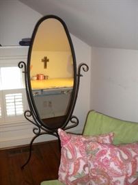 Cheval mirror, a full-length floor-standing mirror mounted in a frame that allows it to swing freely, Fold up indoor casual chair.