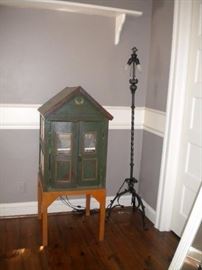 Antique doll house on stand