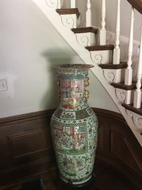 Huge Chinese urn on wooden stand.