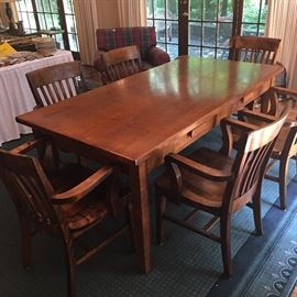 Antique "Partner's Desk" or table has two drawers in the front. Has been refinished beautifully. Also available are 6 antique refinished oak office chairs.