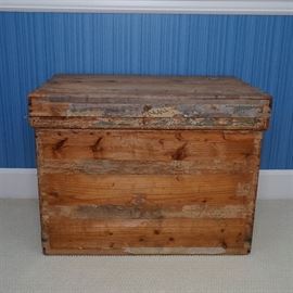 Japanese Tea Chest: A Japanese tea chest. This crate is comprised of wood with a removable wood lid. The interior of the crate is lined with silver-tone paper and the exterior of the crate features various inscriptions.