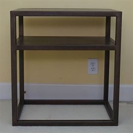Iron and Faux Leather Two Tier Side Table: An iron and faux leather two tier side table. Featuring a brown iron frame, this two tiered side table includes faux reptile leather table tops. No visible maker’s mark.