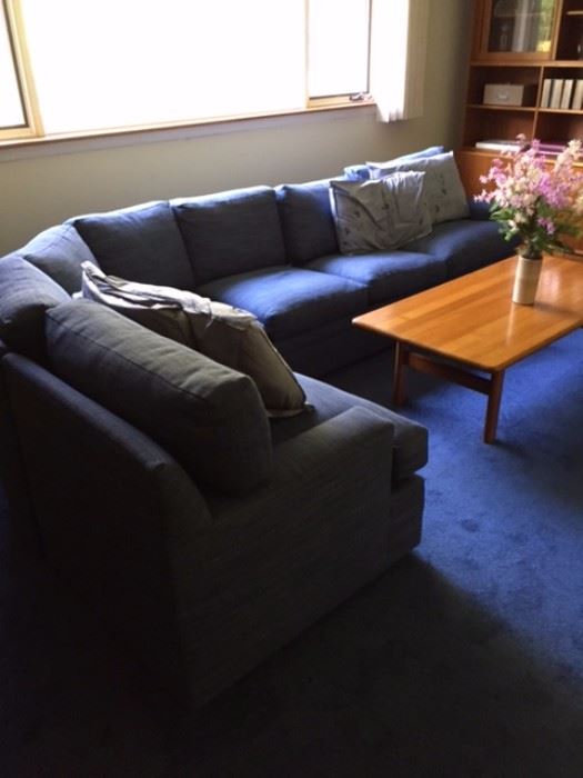 Super comfortable sectional sofa! This piece was re-upholstered four years ago and is in excellent condition. Some slight fading from the sun but this home has no pets, children, or smokers. Extra fabric is included with the purchase of the sectional.  
Coffee table is: 55" X 27" X 18"