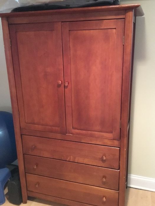 Armoire with shelves and drawers