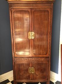 Oriental Style Armoire with Hidden drawer for valuables and interior plugs. No marking of maker we can find but suspect Baker or Drexel. 
