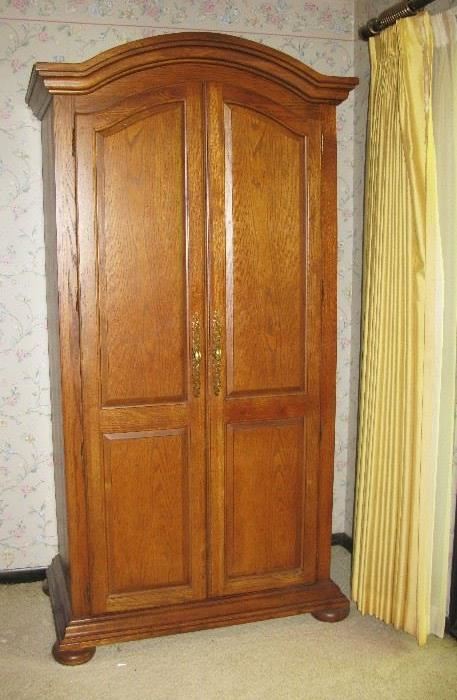 tall and large wardrobe or entertainment senter. solid oak 