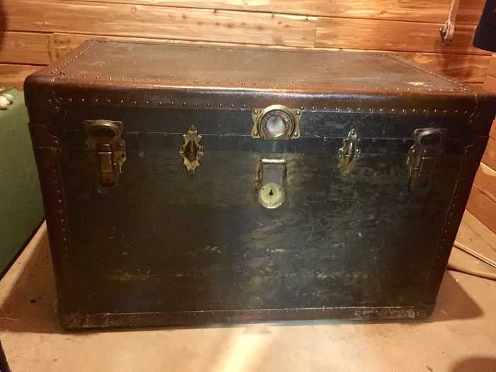 BUY IT NOW!! - Lot #115 - Antique steamer trunk.  Center lock does not latch.  But overall good shape for it's age.  Great for storage or coffee table.  $150