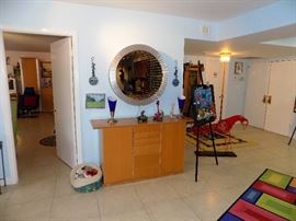 36"INFINITY WALL MIRROR SCULPTURE-$250.00 .BEECH WOOD CONSOLE TABLE WITH DRAWERS -$100.00