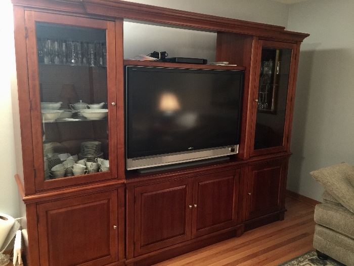 ** BUY IT NOW **  Lot #201 - Beautiful 4 piece entertainment center.  So many possibilities for storage.  Can be used like shown with up to a 50" TV. Or, the lighted side cabinets can be used on their own or placed side-by-side for a china cabinet look.  Each has two glass shelves. The middle cabinet can also be used alone for a larger TV or other decorative cabinet.  Dimensions of piece as shown is 52" w x 21" d x 72" h.  BUY IT NOW for $475