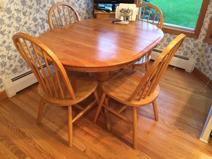 Very solid kitchen table.  Perfect for a smaller area.  Table is shown with the leaf.  Can be made smaller if leaf removed.  Comes with 6 solid chairs.