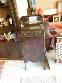 small storage piece with mirror above