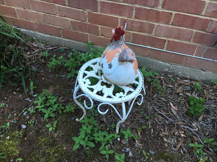 Hen on small metal table