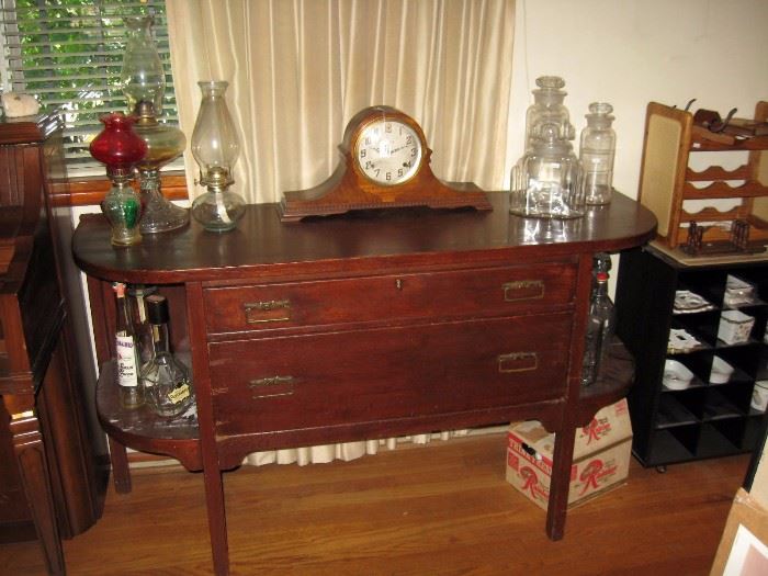 Living Room  Oak Buffet, Windup Clock, Drug Store Jars, Oil Lamps 