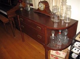 Living Room  Oak Buffet, Windup Clock, Drug Store Jars, Oil Lamps 