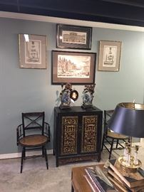 18th c Piranesi and Nolli engravings. Antique Chinese cabinet. Antique French and Chinese Art Nouveau candle holders created around antique Chinese foo dogs. Pair of antique English side chairs.