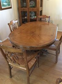 Dining Room table, 2 Captain chairs  4 straight back chairs, woven seats