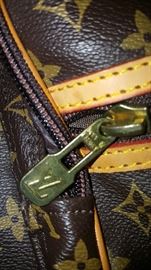 Zipper pull on Louis Vuitton garment bag
