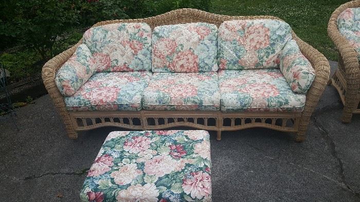 Lane wicker three cushion sofa, one of two, and a
Foot stool