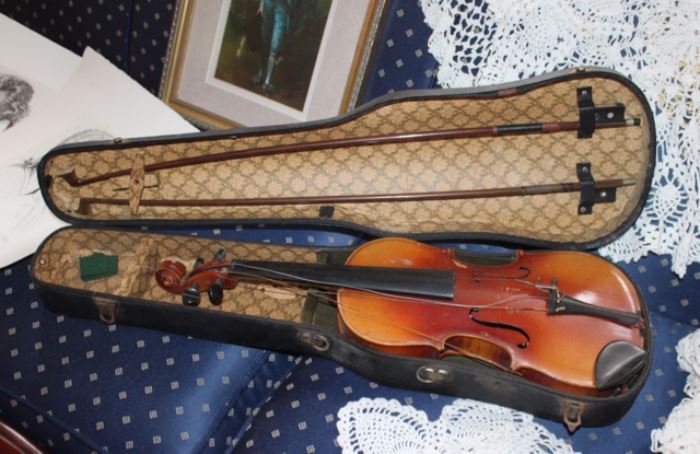 1920's child's violin with 2 bows.  Needs new strings, bridge and soundpost.