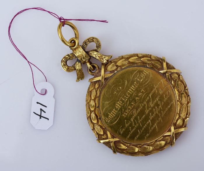 14k Gold Presentation Medal	
awarded to John McKenna "for his
gallantry in jumping overboard from the 
Banger Steamer and saving the life of 
a child...", July 28, 1864
Gift of passengers and crew
23.1 dwt