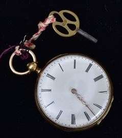 18k Gold Open Face Pocket Watch 	
with floral engraved back, key wind
1 1/2" diameter, 31.7 dwt gross
circa 1875