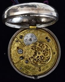 Ben Marks, London Silver Pocket Watch 	
verge, open face, key wind
with silver outer case
has the key, 1 3/4" diameter
late 18th/early 19th century