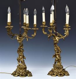 Pair French Bronze Figural Lamps	
each with four lights supported by cherubs
37 3/4" high
late 19th/early 20th century
