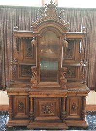 French Renaissance Revival Buffet
surmounted with lions and family crest,
the top section with griffin supports and
the doors with carved game and fruit
76" x 29", 9' 2" high
late 19th century