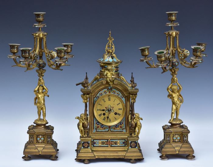 Champleve Enameled Clock Set
with putti figures
16" high clock and 18 1/2" candelabras
circa 1900