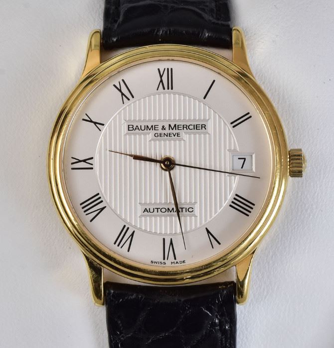 Baume & Mercier 18k Gold Gent's Wrist Watch
automatic with date window
original leather band in the 
original packaging