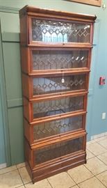 American Lawyer's Stacking Bookcase	
with six leaded glass sections
34" x 12 1/2", 80" high
early 20th century