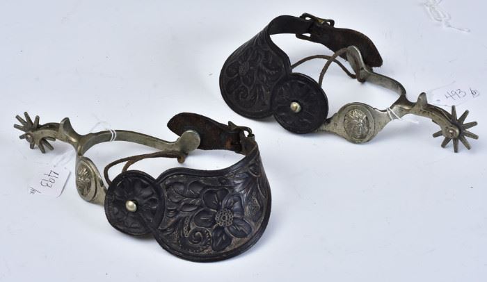 Pair of Western Spurs
with Native American masks
and tooled leather