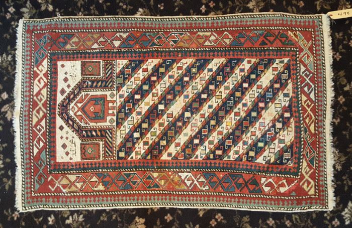Caucasian Carpet	
2' 10" x 4' 5"
signed
early 20th century