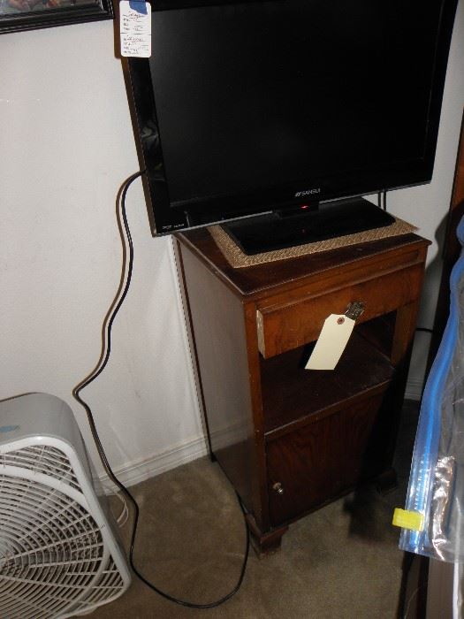 Pair of old side night stands, flat screen tv, fan