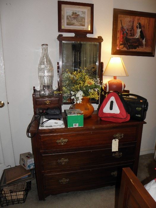 Dresser with glove boxes and swinging mirror, old coke bottle huge, football lamp, blood pressure cuffs
