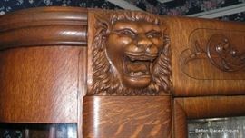 Griffins at top of Oak Display Cabinet.