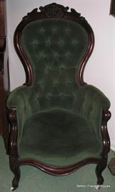 Beautiful Victorian Carved Arm Chair , green velvet seat and buttoned back.