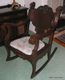 Another Photo of the late 19th Century Mahogany  Rocker, Griffins adorn both top backs.