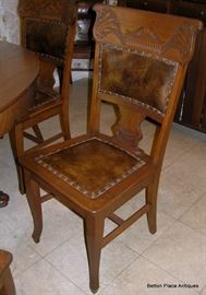 There are 6 Dining Room Chairs and one matching Captain Chair, that are at the Oak Table.