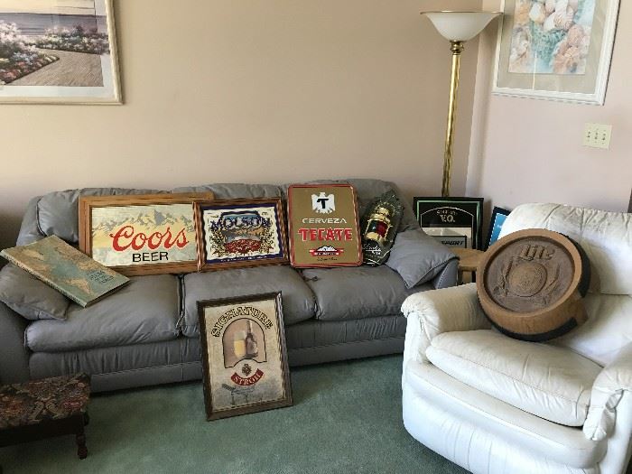 Leather couch and chair, more beer memorabilia