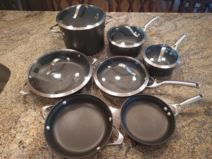 Calphalon 12 Pc. Signature Cookware. Oven Safe. Cool Handles. Can use metal utensils with them.