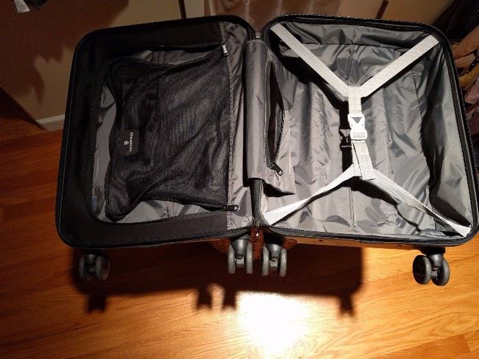 Victorinox carry-on luggage with wheels.