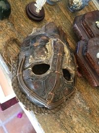 Tribal tortoise shell mask.